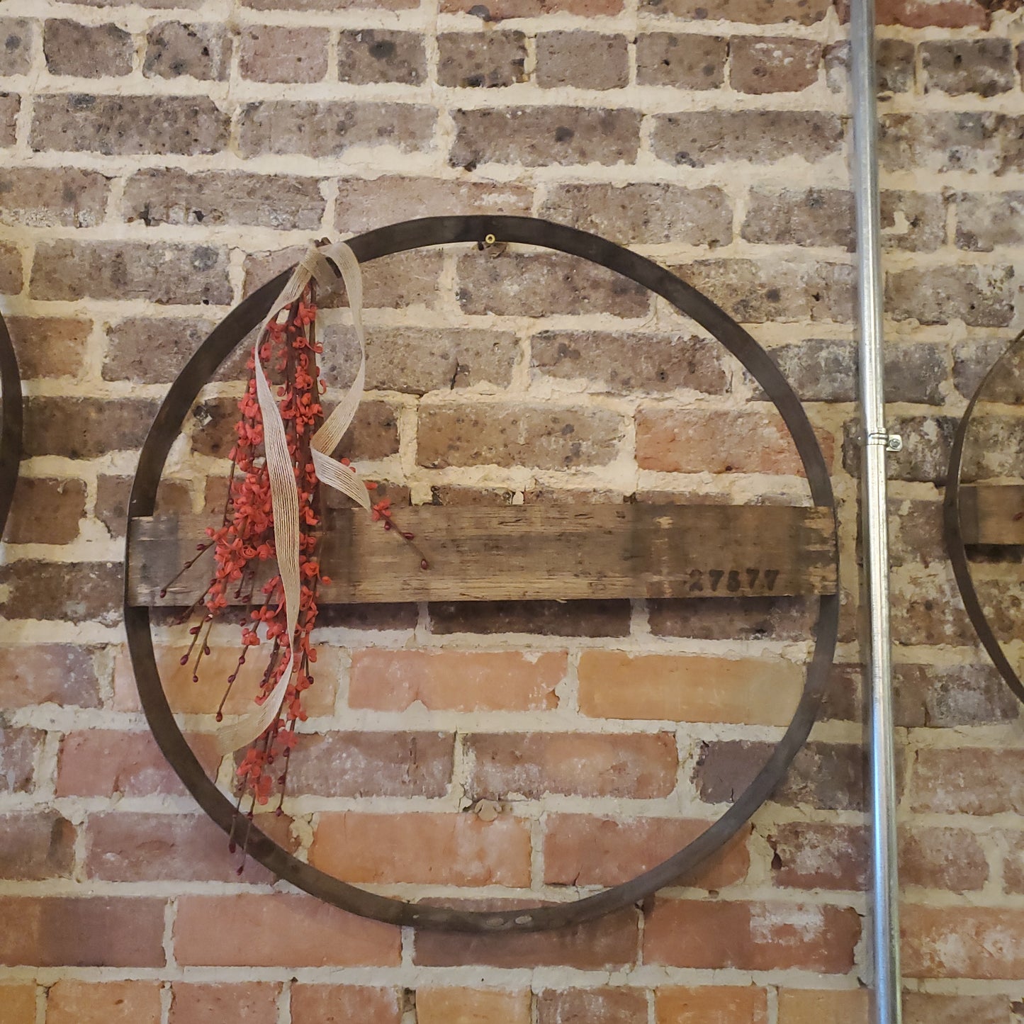Boho whiskey barrel with red buds