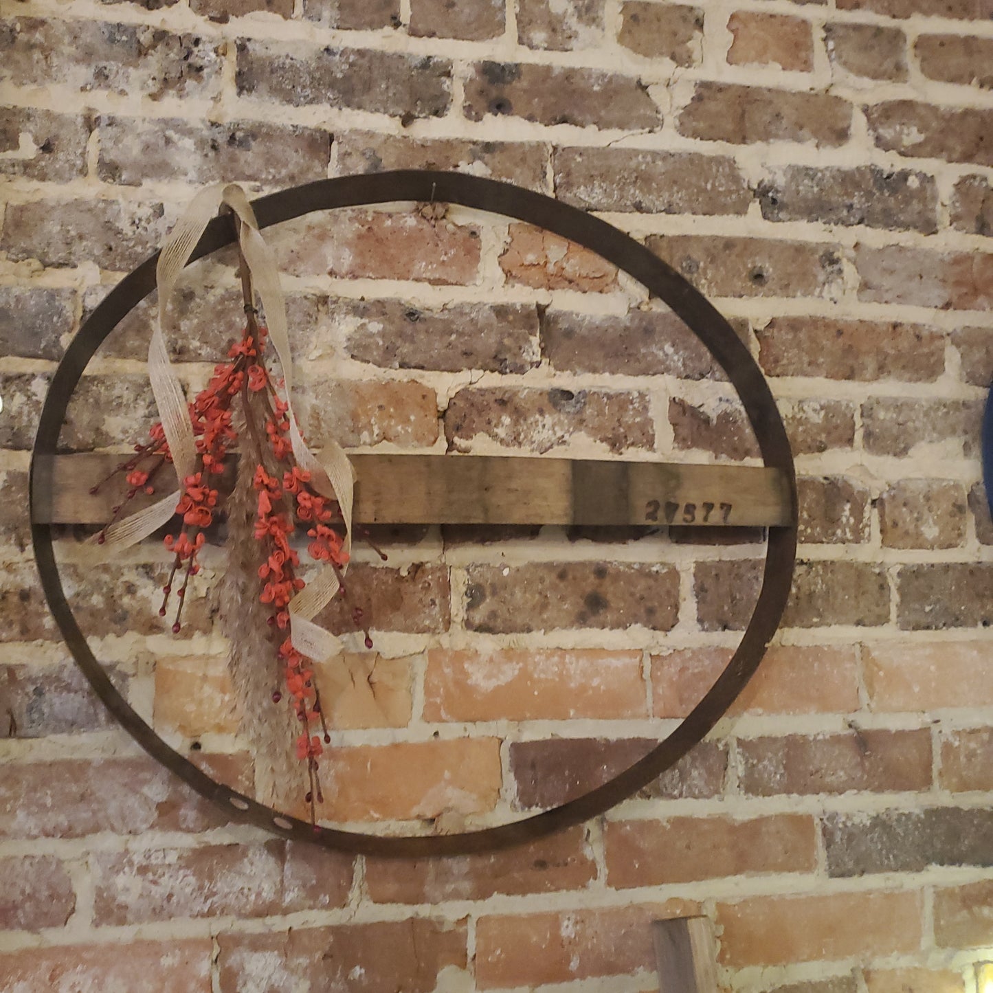 Boho whiskey barrel with red buds