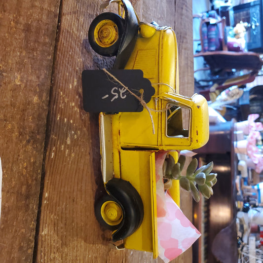 Yellow truck with succulent and bath bomb