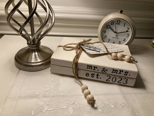“mr. & mrs. est. 2023” bookstack
