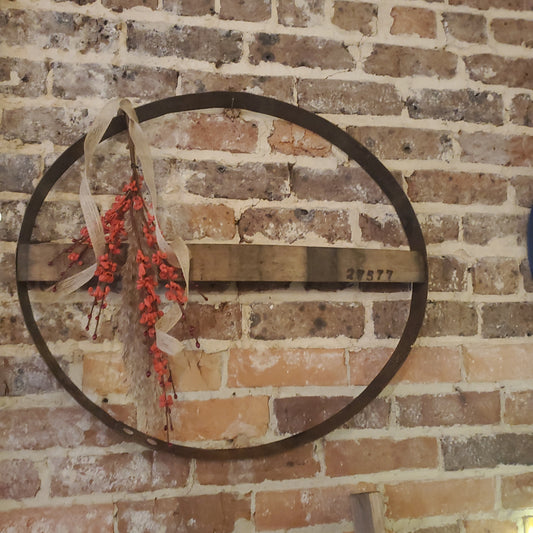 Boho whiskey barrel with red buds