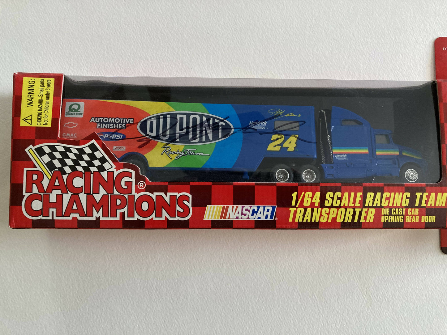 Sports Toy = 1997 Racing Champions 1/64 Stock Car & Transporter both signed by Jeff Gordon